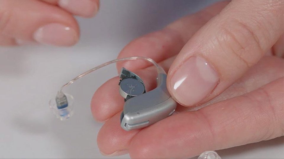 changing hearing aid batteries