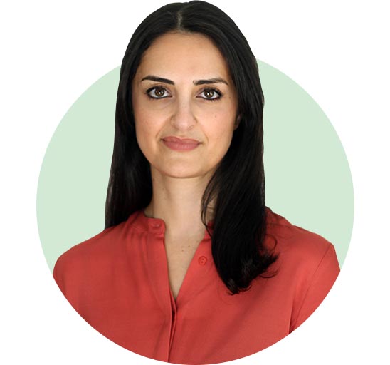 Mona Hemsley wearing a red shirt against a green background