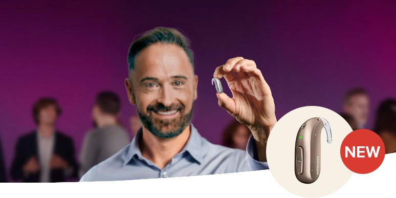 Man holding brand new Oticon Mini BTE-R