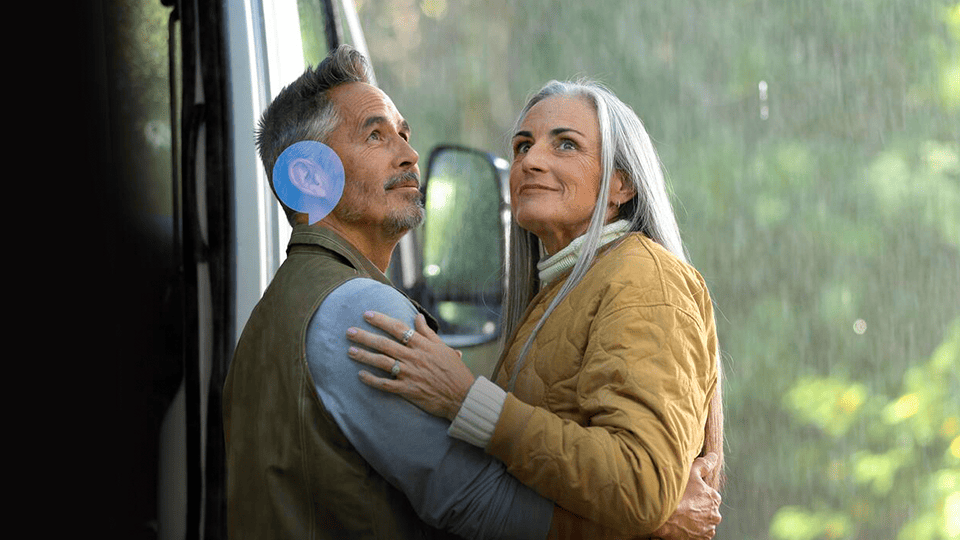 Couple smiling in the rain