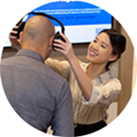 hearing specialist putting on headphones