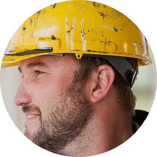 workman wearing a yellow hard hat with visible ear for hearing protection or hearing aid promotion