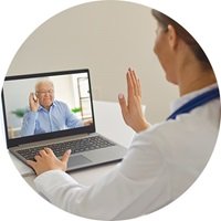 Telehealth appointment with hearing care clinician using a laptop
