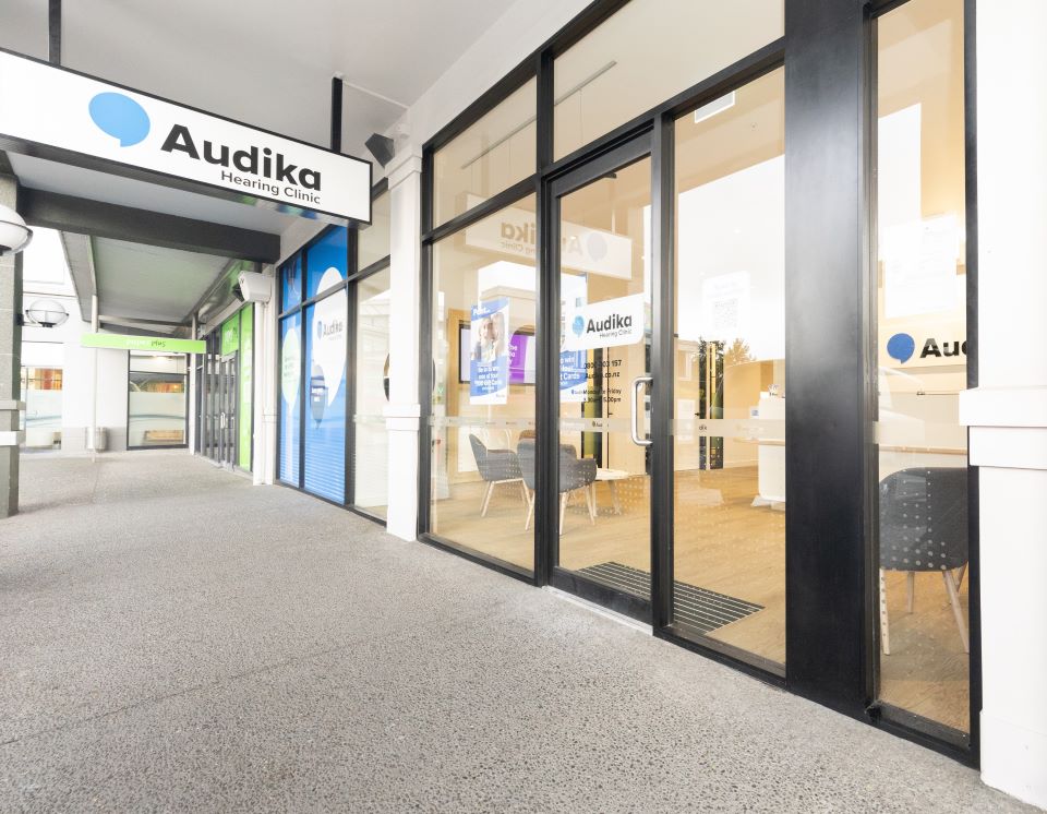 Audika Hearing Aid Clinic storefront in Barrington, featuring glass doors and clinic branding.