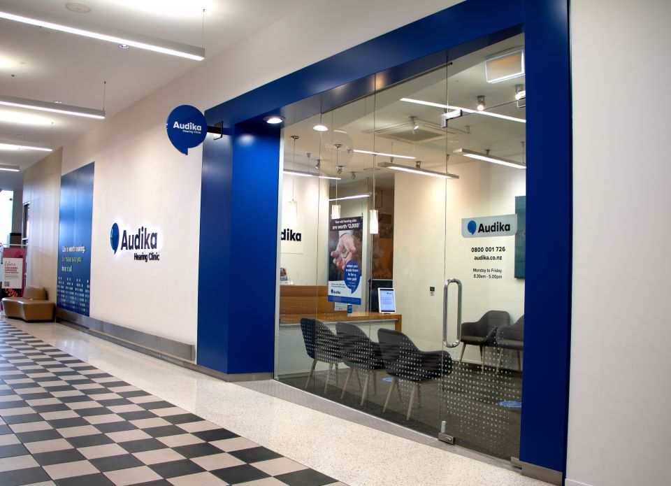 Audika Hearing Clinic in Botany featuring a modern storefront with branded signage, glass entrance, and comfortable seating area inside.