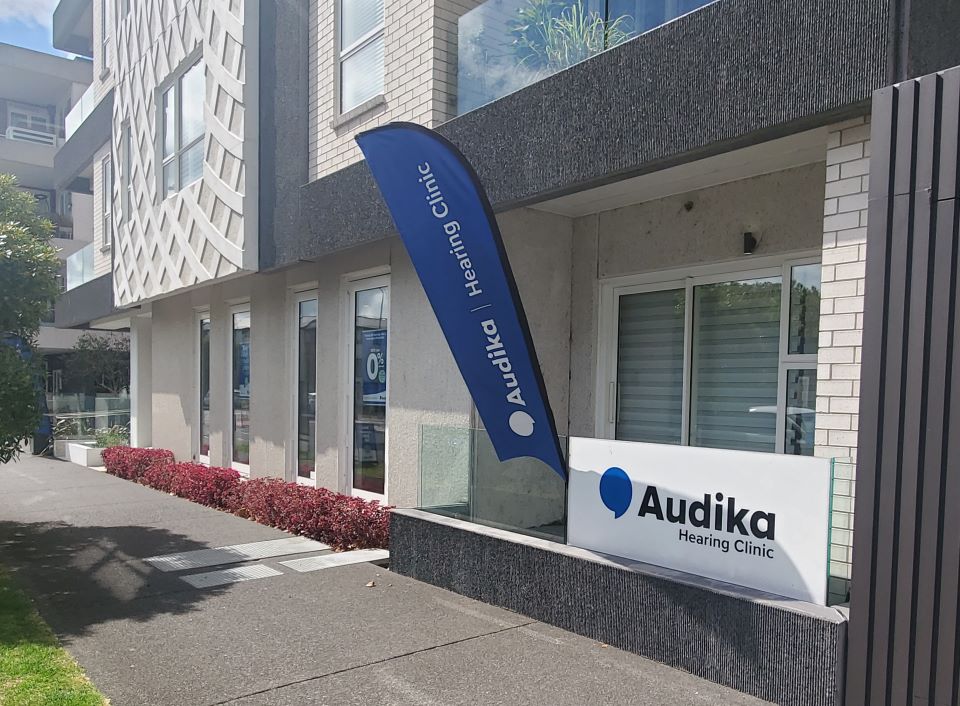 Audika Hearing Clinic in Grey Lynn with building exterior, signage, and branded flag visible.