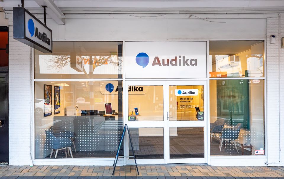 Audika hearing clinic storefront in Timaru with glass windows and signage displaying the Audika logo.