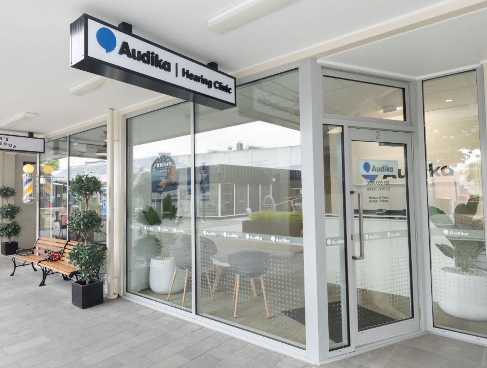 Audika Hearing Aid Clinic in Rangiora, New Zealand, featuring modern glass-front design with visible signage and a welcoming entrance.
