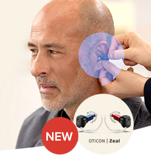 Man_being_fitted_with_Oticon_zeal_hearing_aid_and_an_insert_picture_of_oticon_zeal_hearing_aids_and_red_bubble_with_the_word_new_