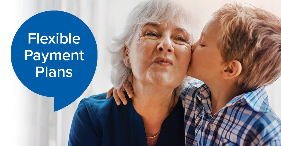 grandson kissing grandmother on cheek with text bubble reading 'Flexible Payment Plans'
