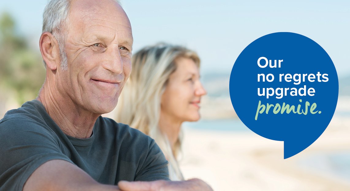 Man_and_woman_sitting_on_beach_looking_into_distance
