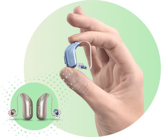Hand holding a sleek blue hearing aid with additional hearing aid models showcased on a green gradient background.