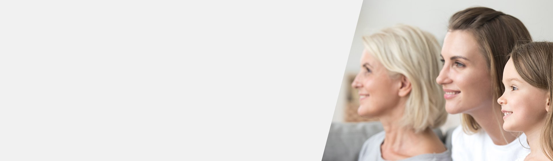 Three generations of women sitting together, highlighting age-related hearing loss in the eldest.