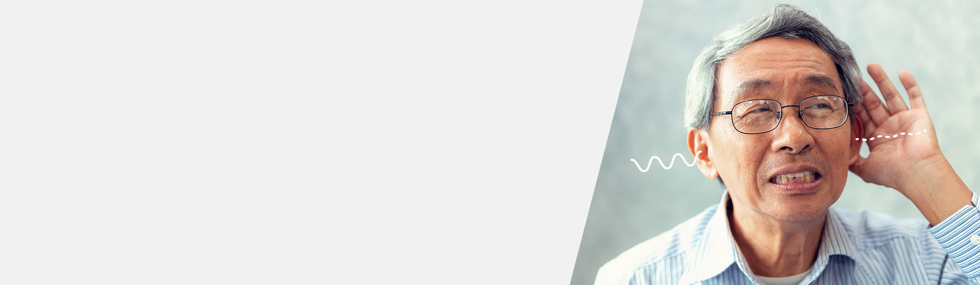 Man with unilateral hearing loss holding hand to ear.