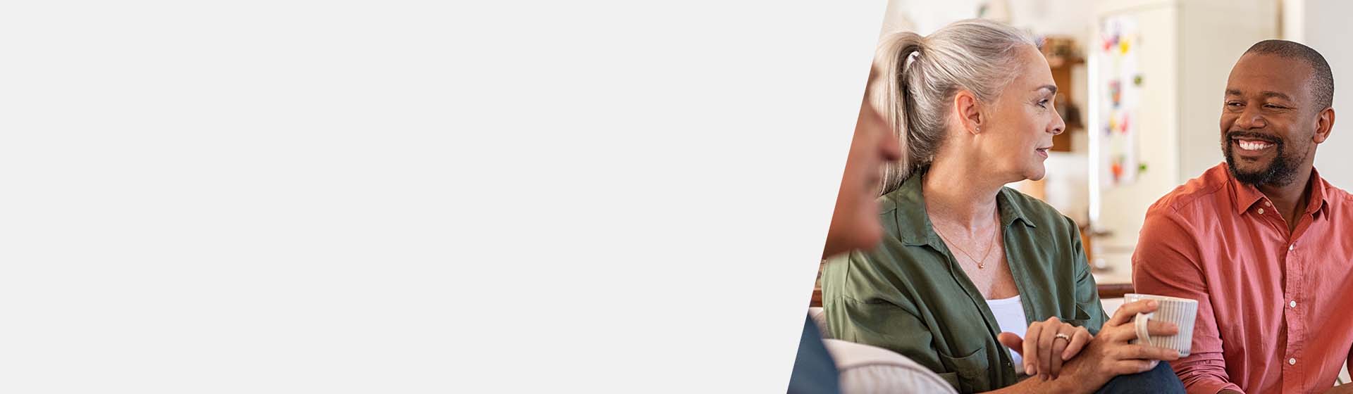 People discussing hearing loss solutions in a supportive group setting.