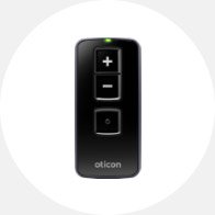 Hearing aid remote control with volume adjustment buttons and Oticon branding.