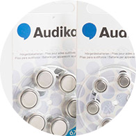 Audika hearing aid battery packs with visible batteries