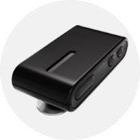 A sleek black hearing aid accessory featuring buttons and a slim rectangular design; it likely serves as a wireless microphone or streamer, enhancing connectivity in hearing care contexts. No text is visible.