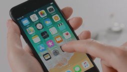 Pair hearing aids with the Oticon app using a smartphone.