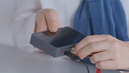 Connecting a TV adapter to enable hearing aid users to hear TV sounds clearly