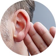 Hand cupped near an ear, symbolizing listening or hearing attentively.