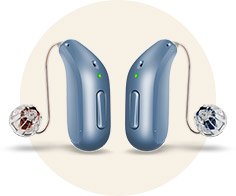 Two sleek, blue Oticon hearing aids with visible receiver-in-canal (RIC) components sit front-facing, emitting a green light, displayed against a soft beige circular background for emphasis.