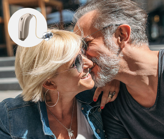 Image shows couple and a miniRITE hearing aid