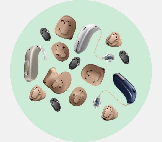 Various hearing aids, including behind-the-ear and in-the-ear models, are displayed on a light green circular background, showcasing different styles and sizes from beige, black, and blue color options. No text is present.