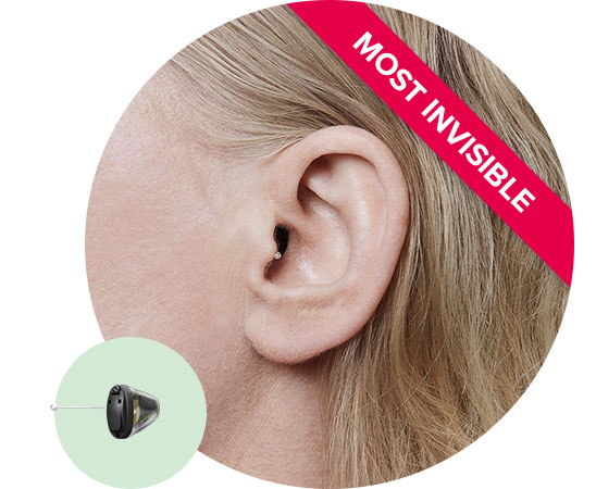 Invisible-in-the-canal hearing aid placed discreetly inside the ear with a ’Most Invisible’ label highlighting its subtle design.