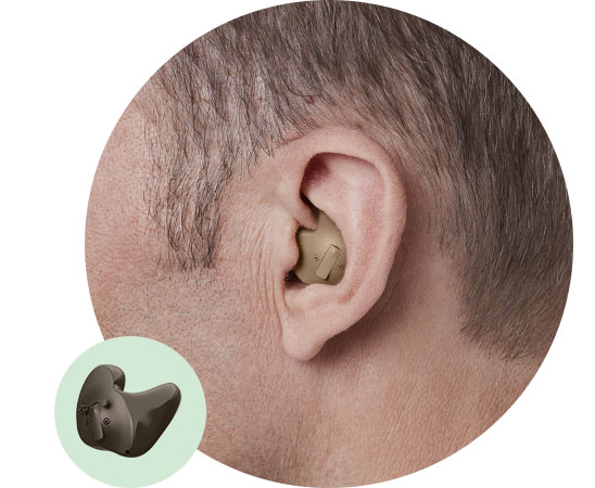 In-the-ear full shell hearing aid fitted in the ear of an adult male.